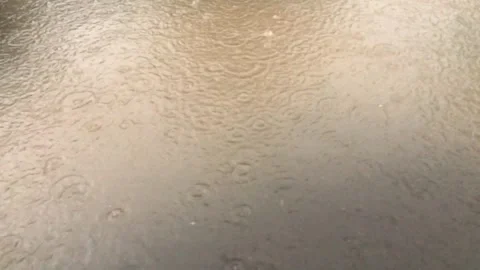 Rain water dripping on puddles surface Stock Footage 297237216