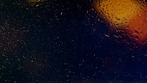 Rain water droplets trickling down the window pane at night Video stock 126156108