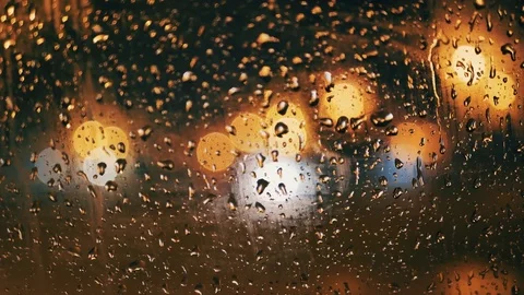 Rain Water Drops on car Window in Rainy night with Blurred Night City Traffic Stock Footage 84764568