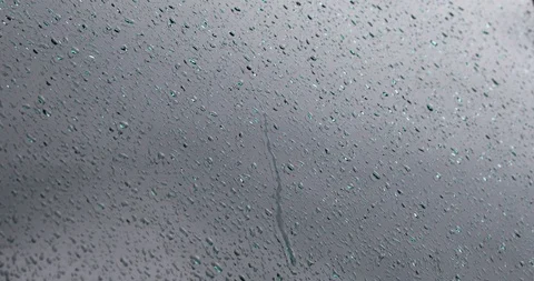 Rain water drops close-up on glass window Stock Footage 111399792