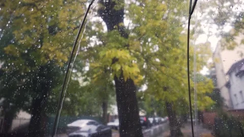 Rain water drops fall on transparent umbrella on street outdoors. Autumn weather Stock Footage 140818180