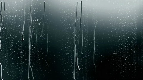 Rain water drops Falling Down On the Window Glass in slow motion, Stock Footage 95393565