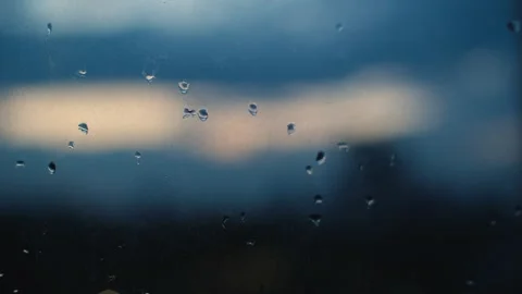 Rain water drops on glass surface. Abstract wet droplets on transparent window Stock Footage 251734540