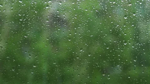 Rain water drops on a window glass Vídeos de archivo 76601467