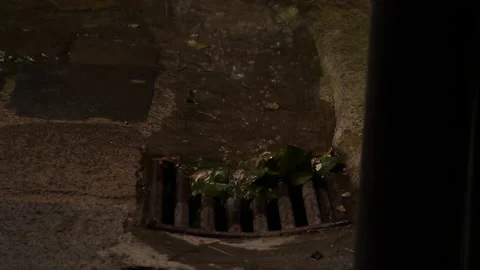 Rain water flowing down old sewage system in small village in Italy. Stock Footage 214299981