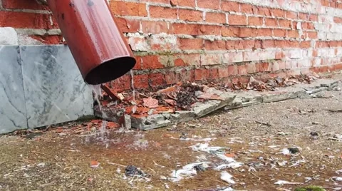 Rain water flowing from drain pipe closeup Stock Footage 62379128
