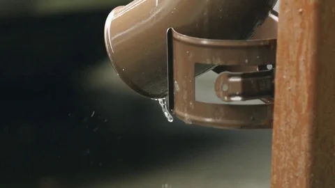 Rain water flowing from drain pipe closeup Stock-Footage 77583469