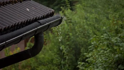 Rain water flowing from a gutter Stock Footage 138794920