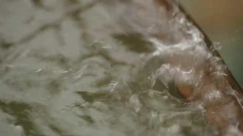 Rain water flowing into an old rusty barrel. Rain drops closeup. Stock Footage 99012184