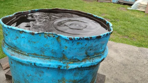 Rain water flowing into old rusty with sound Stock Footage 106531891