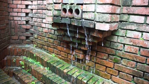 Rain water flows down the wall on a rainy day Stock Footage 161954074