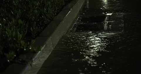 Rain water in gutter with focus pull Stock Footage 277388374