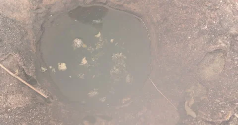 Rain water puddle on raw stone Видео 335632388