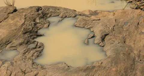 Rain water puddle on raw stone 写真素材