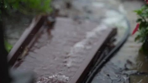 Rain Water Running Down a Rain Gutter in Slow Motion 스톡 동영상 136640020
