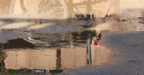Rain water running on road Stock Footage 324498643