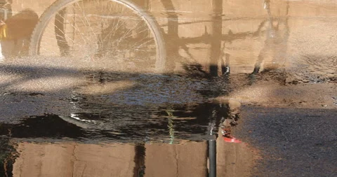 Rain water running on road Stock Footage 324498888