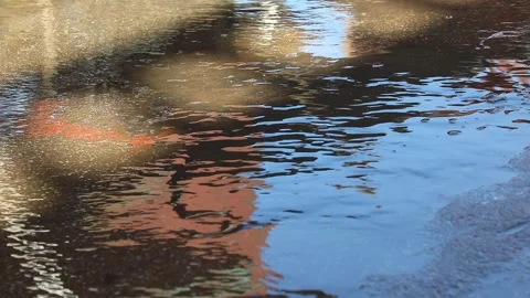 Rain water running on road Stock Footage 324500589