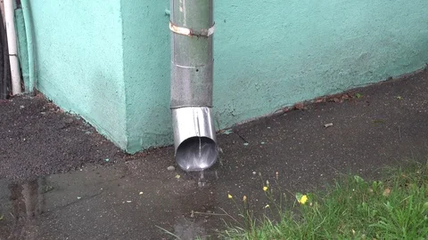 Rain water running through downpipe Stock Footage 114264508