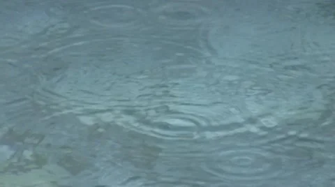 Rain on water surface Stock Footage 10823234