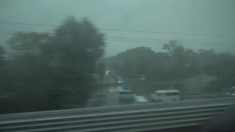 Rain water on a train window. View from a moving bullet train Shinkansen. Stock Footage 136510771