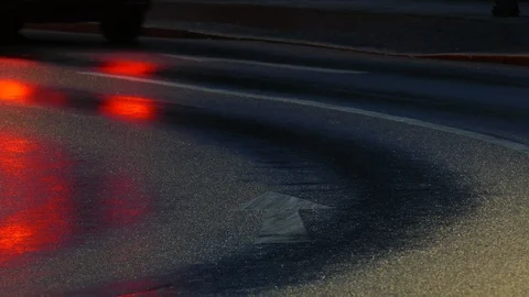 Rain wet road, lights, directional arrows in the rain at dusk, Bremen, German Stock Footage 100835955
