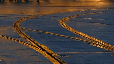 Rain wet road; lights; Tram rails and colorful water reflections in the rain Stock Footage 100328077
