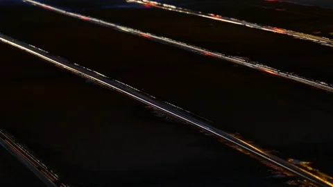 Rain wet road; lights; Tram rails and colorful water reflections in the rain Stock Footage 100836930