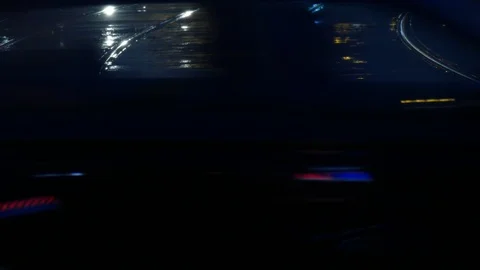 Rain wet road; lights; Tram rails and colorful water reflections in the rain Stock Footage 101026163
