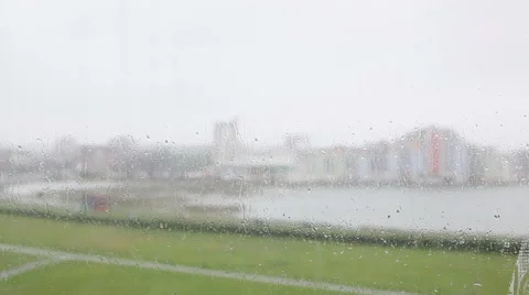 Rain on the window bay and building in bg Stock Footage 50008883