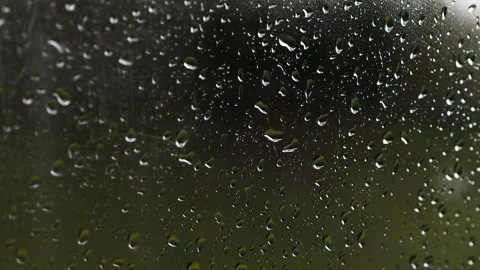 Rain on a window blur background video Stock Footage 255153004