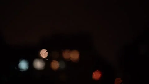 Rain on the window with blury lights SlowMotion Stock Footage 161757923