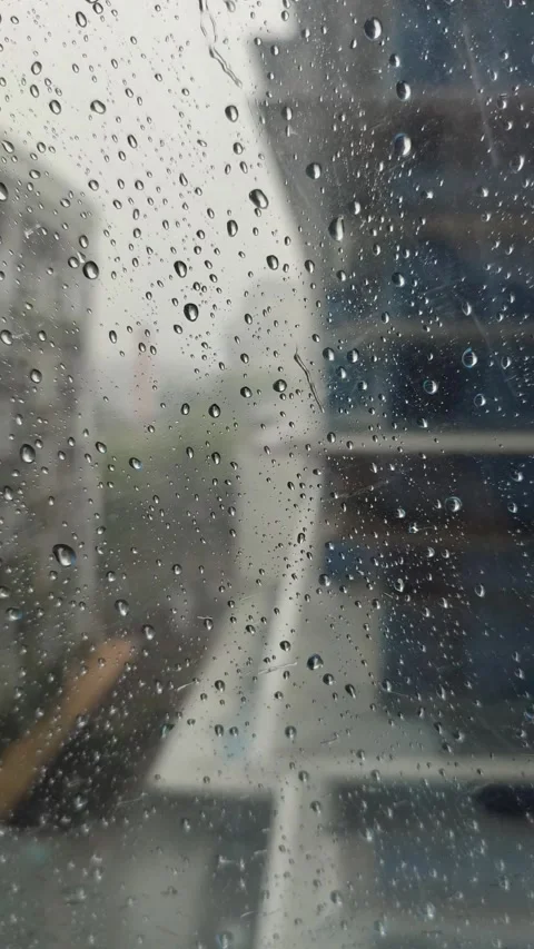 Rain on the window glass of the building Stock Footage 292914628