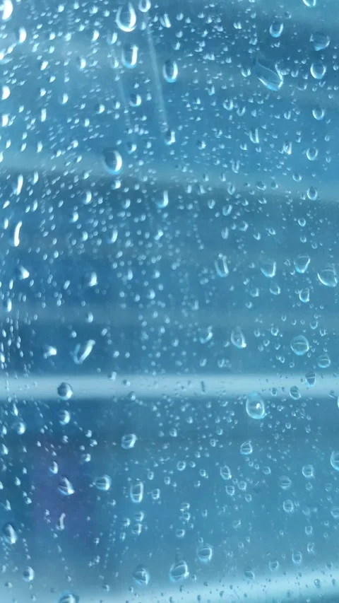 Rain on the window glass of the building Stock Footage 323213788