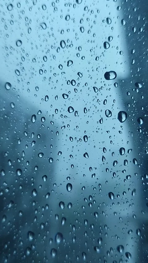 Rain on the window glass of the building Stock Footage 323213792