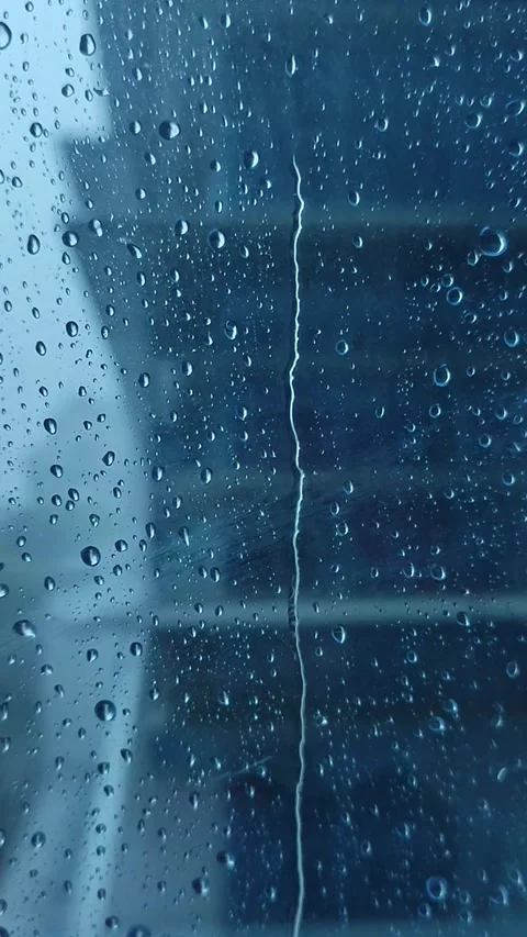 Rain on the window glass of the building Stock Footage 323213802
