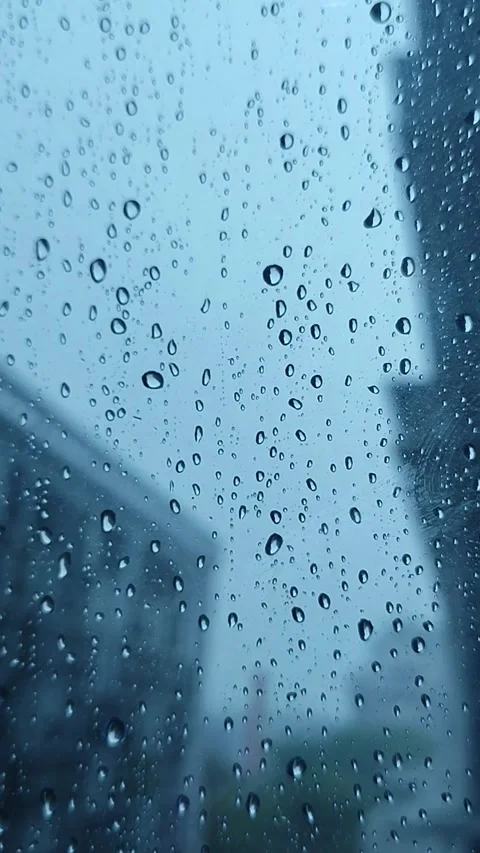 Rain on the window glass of the building Stock Footage 323213830
