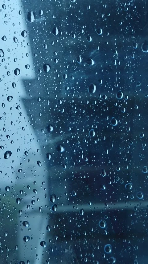 Rain on the window glass of the building Stock Footage 323213831