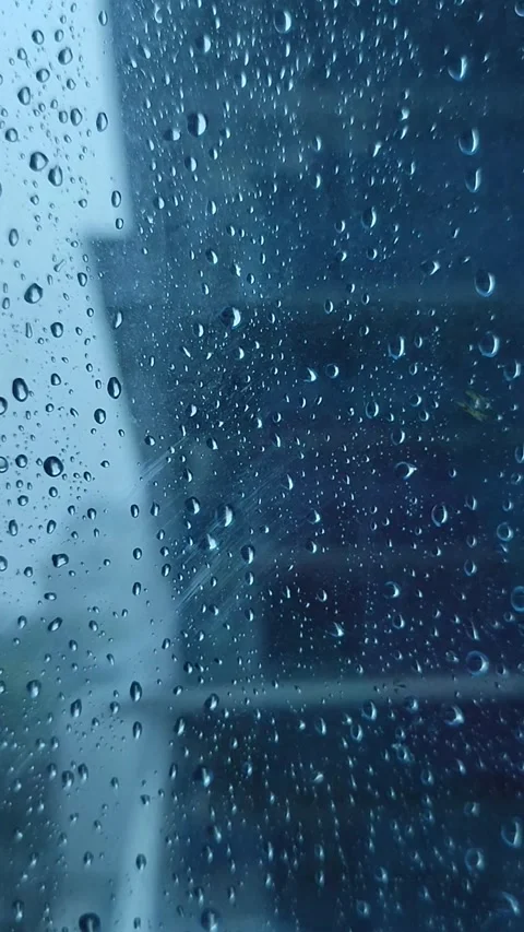 Rain on the window glass of the building Stock Footage 323213832
