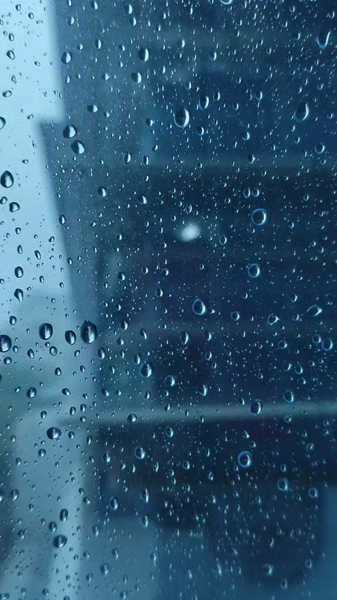 Rain on the window glass of the building Stock Footage 323213835