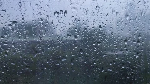 Rain on the window glass of the building Stock Footage 323213954