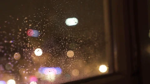 Rain on Window with Lights out of Focus at Night - Shallow Depth of Field Stock Footage 91780510