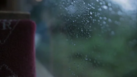 Rain on the window of a moving vintage steam train carriage Stock Footage 128355649