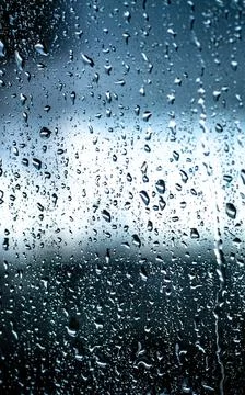 Rain on Window Pane Capturing Nature's Melancholic Mood Stock Photos