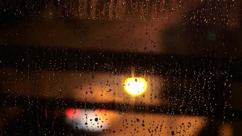 Rain on Window Traffic Lights in Background Video stock 78810541