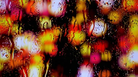 Rain on window tree lights view  Stock Footage 168894378