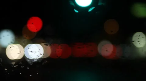 Rain on windshield with bokeh Stock Footage 8522355