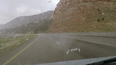 Rain on windshield, driving on I70 through Utah desert. Stock Footage 95163322