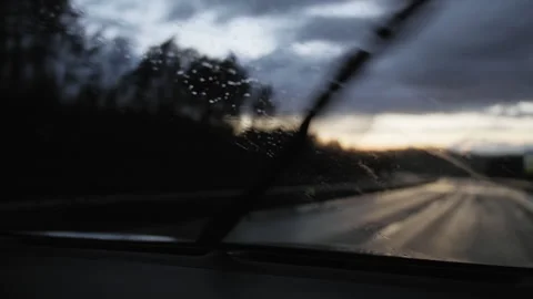 Rain On Windshield - Windscreen Wipers Wiping Raindrops - Slow Motion FPV / POV Stock Footage 161961101
