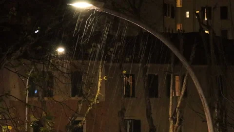 Rain in the winter between the city lights - 4k - ProRes Stock Footage 145828980